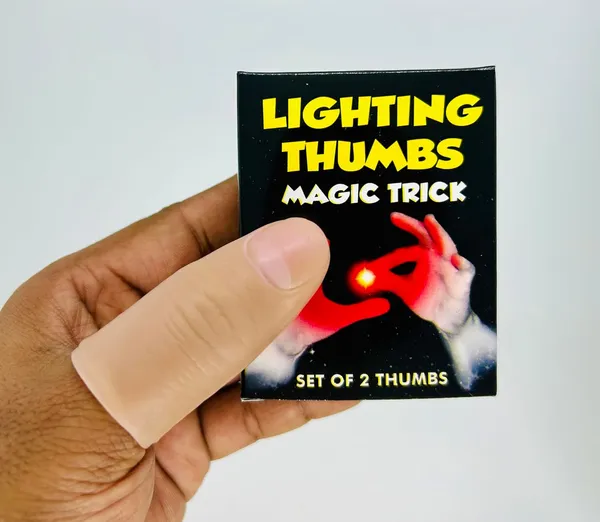 Red_Thumb_Light_Magic_Trick_–_Glowing_Finger_Illusion_Prop_for_Magicians_(Pack_of_2)