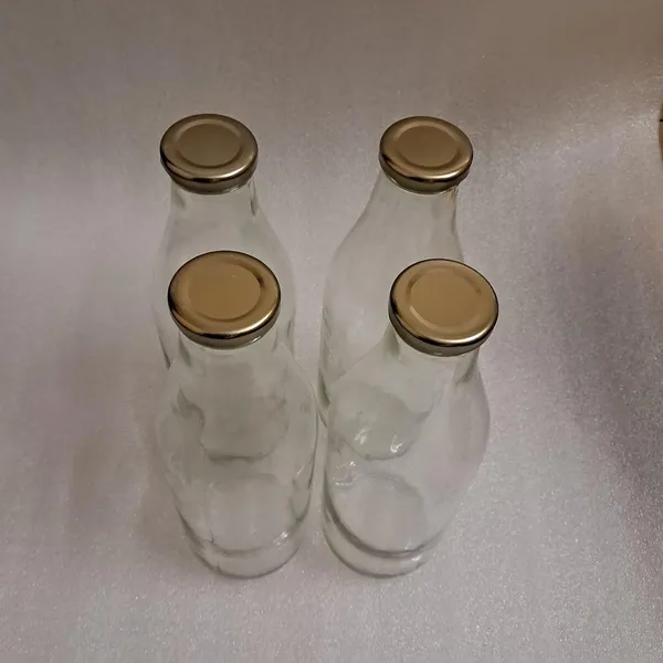 Sunshine_hygienic_leak_proof_airtight_cap_beverage_glass_bottles_suitable_for_Juice_Milk_Water_and_reusable_for_fridge_traveling_storage_drinking_clear_glass_bottles_(1000ml)_pack_of_(4)