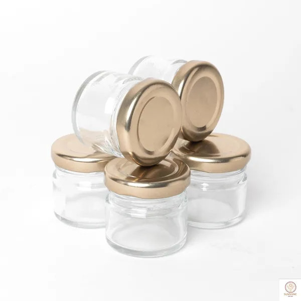 Clear_Round_Mini_Glass_Jar_Container_With_Airtight_Metal_Lid_-_20_Gram,_100_Pieces