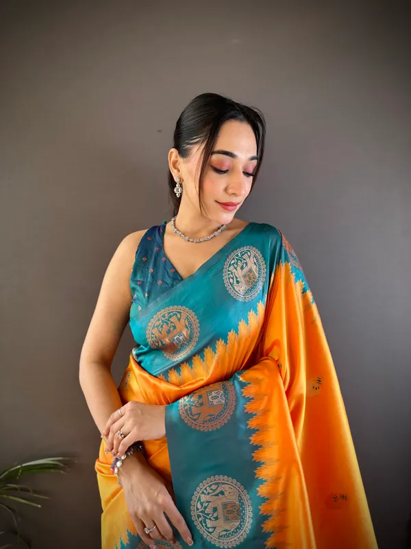 Radiant_Orange_&_Teal_Blue_Silk_Saree_With_Intricate_Temple_Border_And_Traditional
