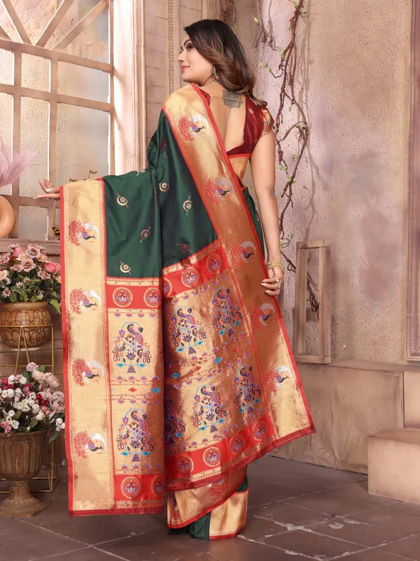 Forest_Green_&_Red_Silk_Saree_With_Resplendent_Border_And_Exquisite_Gold_Zari_Peacock