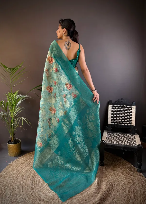 Teal_Or_Sea_Green_Floral_Organza_Saree_With_Zari_Border