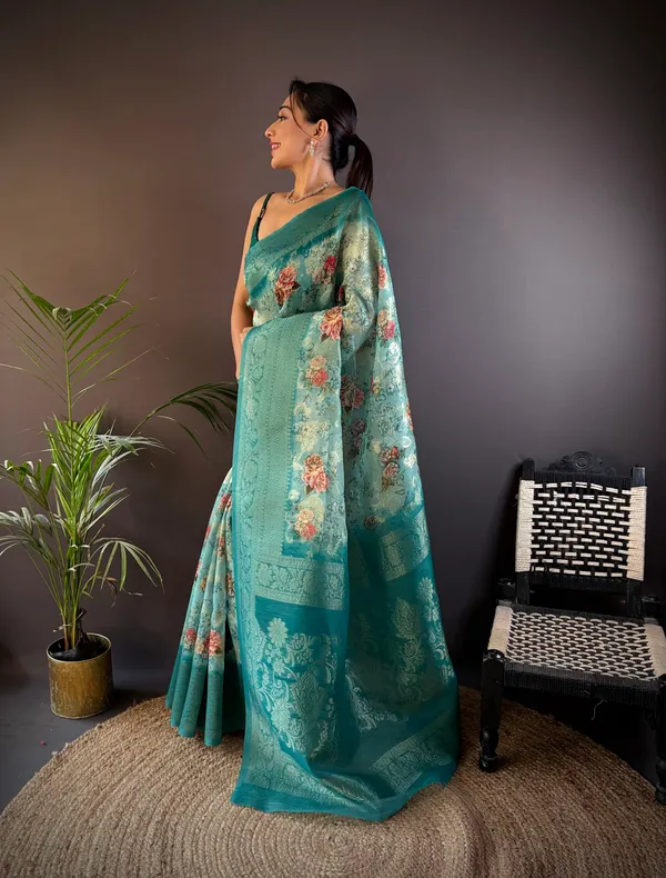 Teal_Or_Sea_Green_Floral_Organza_Saree_With_Zari_Border