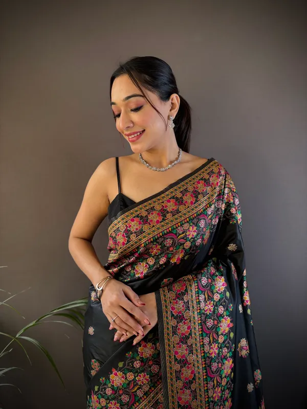 Jet_Black_Luxurious_Patola_Handloom_Saree_Featuring_A_Kaleidoscope_Of_Traditional_Animal