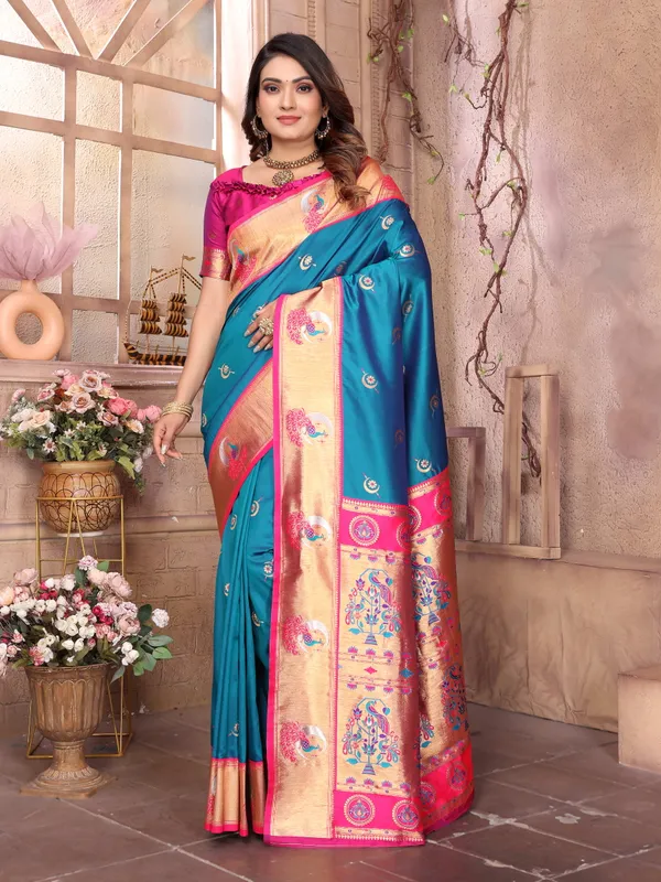 Teal_Blue_&_Fuchsia_Pink_Silk_Saree_With_Border_And_Exquisite_Zari_Woven_Peacock_Designs