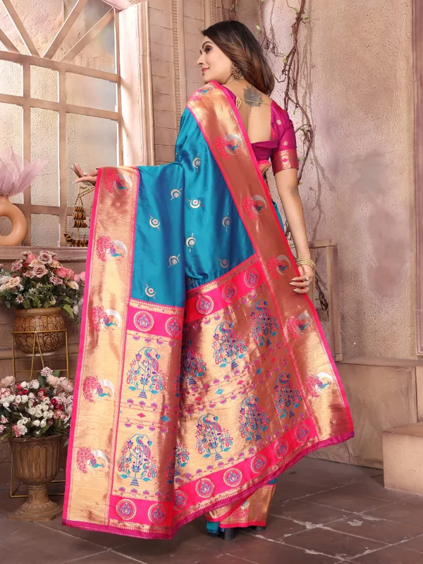 Teal_Blue_&_Fuchsia_Pink_Silk_Saree_With_Border_And_Exquisite_Zari_Woven_Peacock_Designs