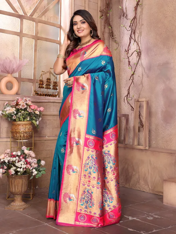Teal_Blue_&_Fuchsia_Pink_Silk_Saree_With_Border_And_Exquisite_Zari_Woven_Peacock_Designs