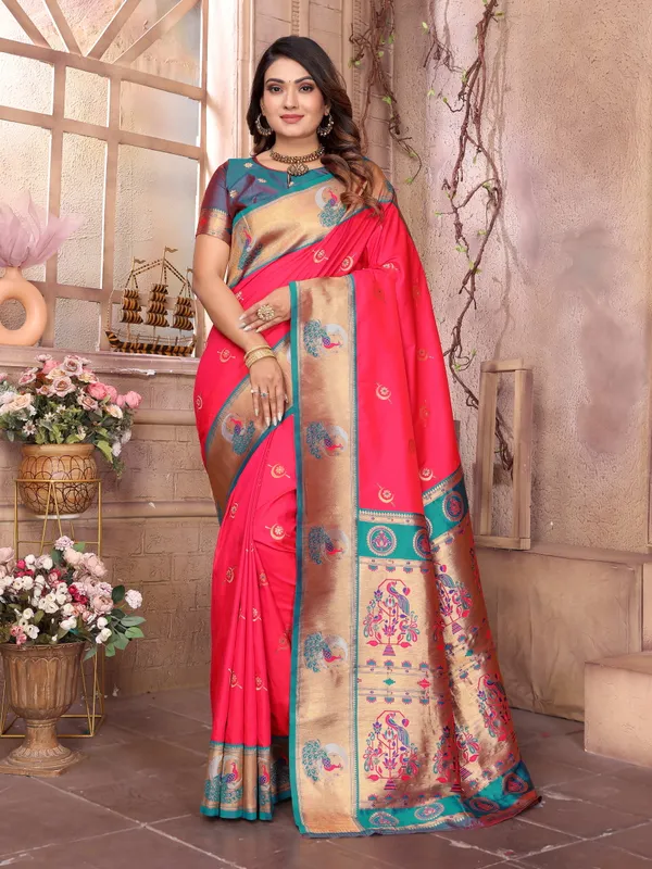 Burnt_Orange_&_Teal_Blue_Vibrant_Silk_Saree_With_Striking_Border_And_Elaborate_Zari_Woven_Motifs