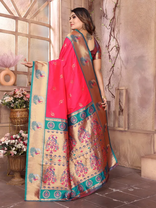Burnt_Orange_&_Teal_Blue_Vibrant_Silk_Saree_With_Striking_Border_And_Elaborate_Zari_Woven_Motifs