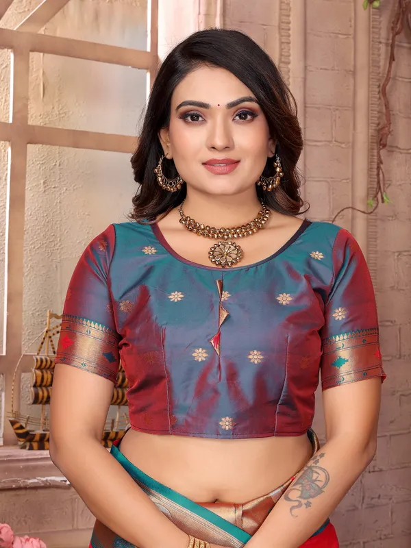 Burnt_Orange_&_Teal_Blue_Vibrant_Silk_Saree_With_Striking_Border_And_Elaborate_Zari_Woven_Motifs