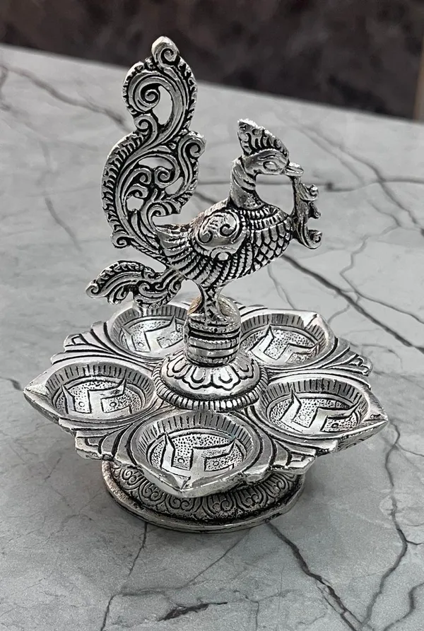 Metal_Lotus_Shaped_Peacock_Diya,_5_Oil_Wick_Diya