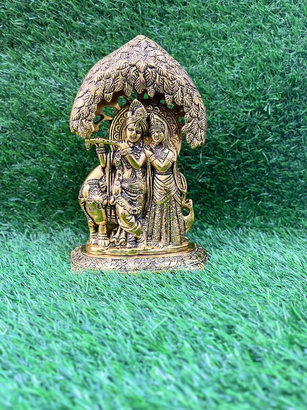 Radha_Krishna_Idol_Statue_with_Diya_Peacock_Design_Decorative_Showpiece_Religious_Handicraft_Idol_for_Gift_Puja_Room_Décor,_18_cm_(Metal,_Gold_Radha_Krishna_Gold)