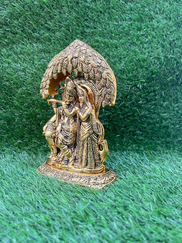 Radha_Krishna_Idol_Statue_with_Diya_Peacock_Design_Decorative_Showpiece_Religious_Handicraft_Idol_for_Gift_Puja_Room_Décor,_18_cm_(Metal,_Gold_Radha_Krishna_Gold)