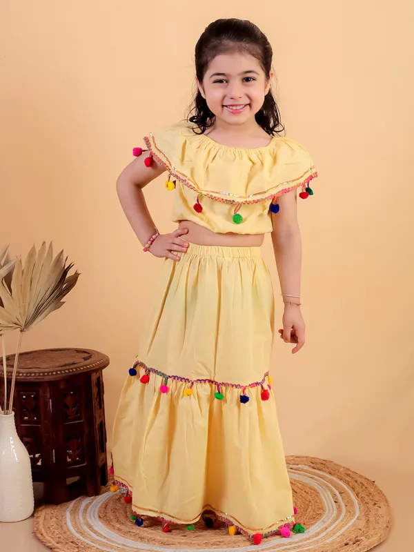 Yellow_Pure_Cotton_Crop_Top_And_Long_Skirt_Embellished_With_Pompom_Tussal