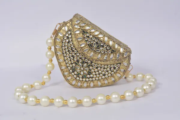 Gold_Mehira_Royal_Kundan_Bag_With_Sparkling_Stones,_Green_Gem,_And_Pearl_Handle