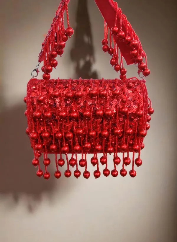 Radiant_Red_Sequin_Clutch_with_Glossy_Bead_Tassels_–_Bold_Elegance_for_Festive_Evenings