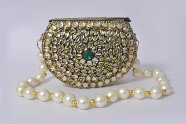 Gold_Kundalya_Pearl_Charm_Clutch_With_Emerald_Stone_Detailing_And_Royal_Gold_Finish
