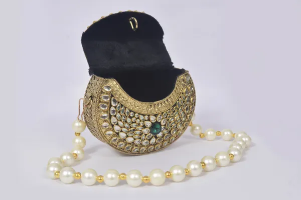 Gold_Kundalya_Pearl_Charm_Clutch_With_Emerald_Stone_Detailing_And_Royal_Gold_Finish
