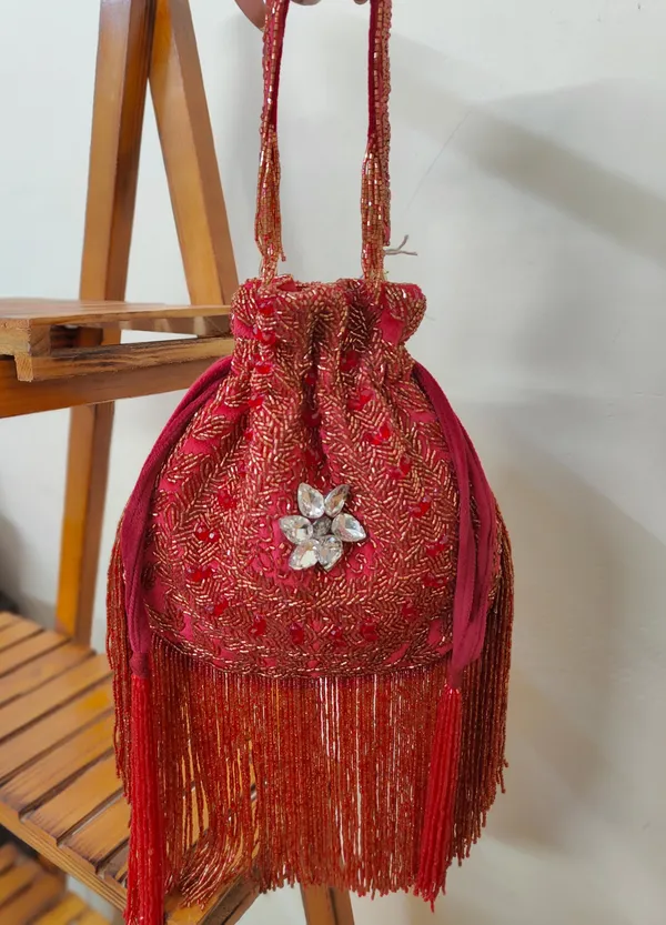 Red_And_Silver_Elegant_Embellished_Designer_Potli_With_Intricate_Beadwork_And_Fringed_Detailing_For_Women