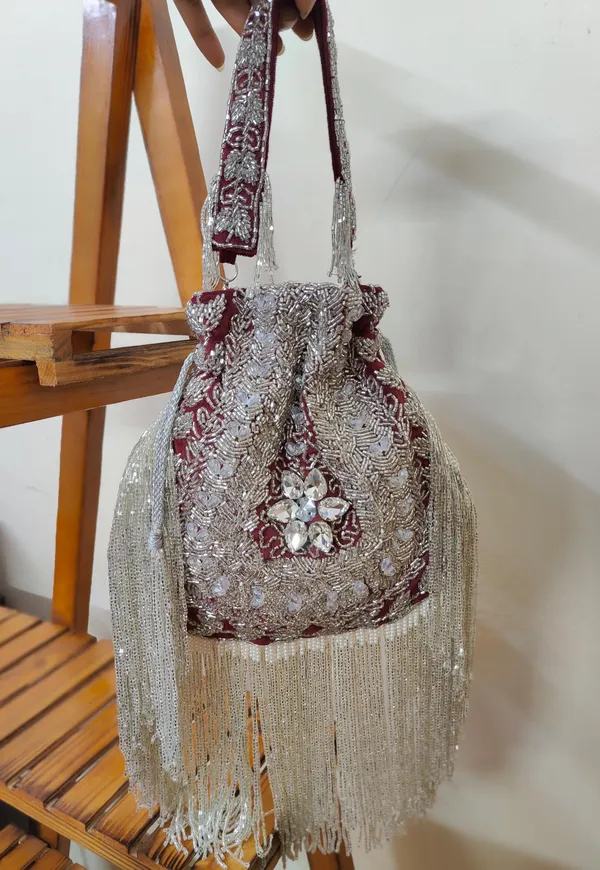 Red_And_Silver_Elegant_Embellished_Designer_Potli_With_Intricate_Beadwork_And_Fringed_Detailing_For_Women