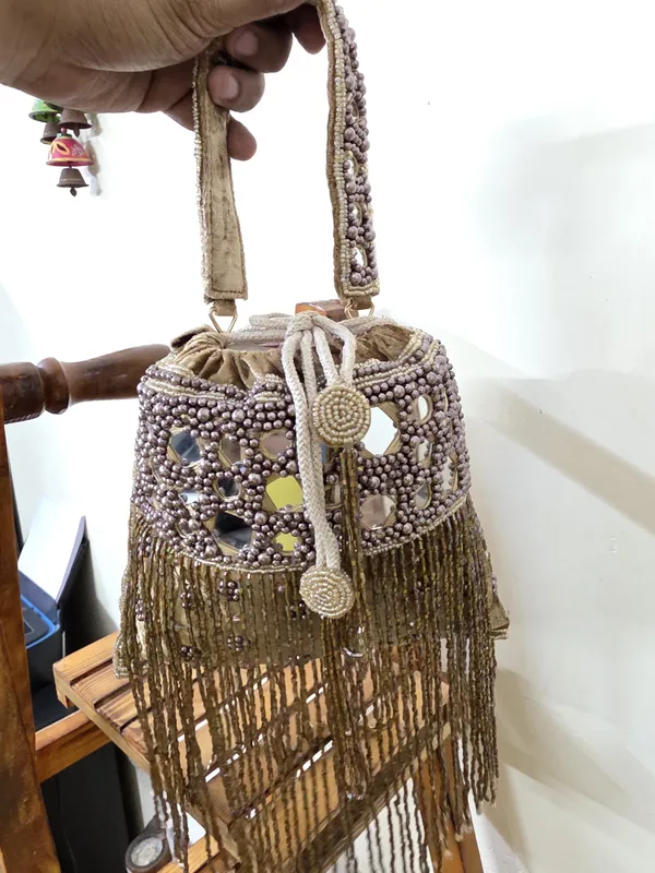 Brown_Multicolor_Elegant_Potli_With_Pearls,_Mirrors,_And_Fringe_Detailing