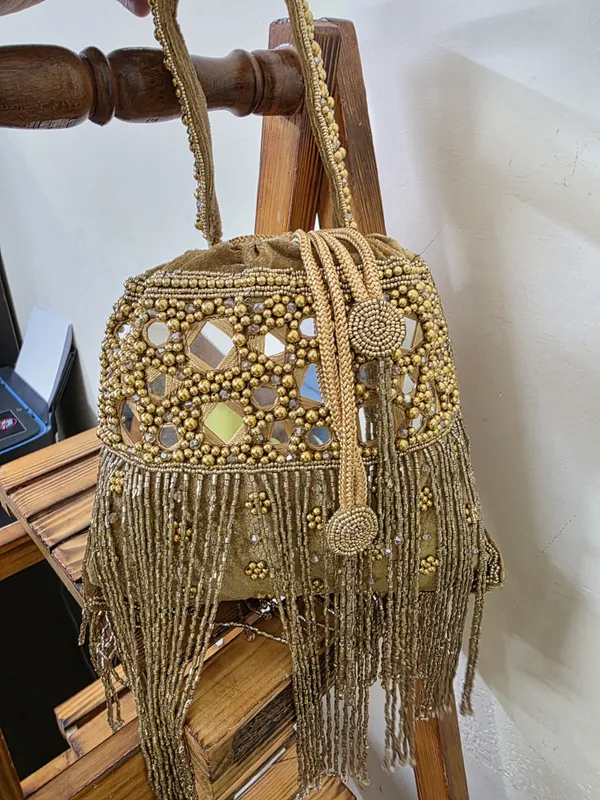 Brown_Elegant_Potli_With_Pearls,_Mirrors,_And_Fringe_Detailing