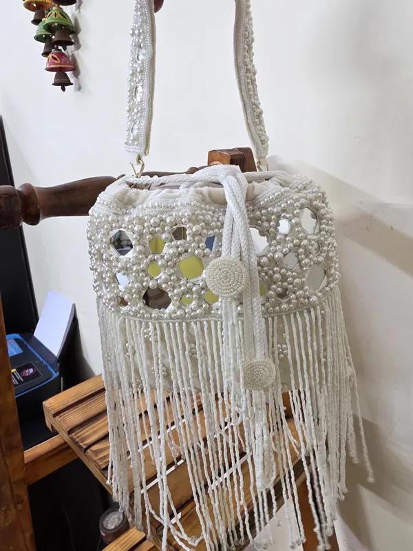 White_Elegant_Potli_With_Pearls,_Mirrors,_And_Fringe_Detailing