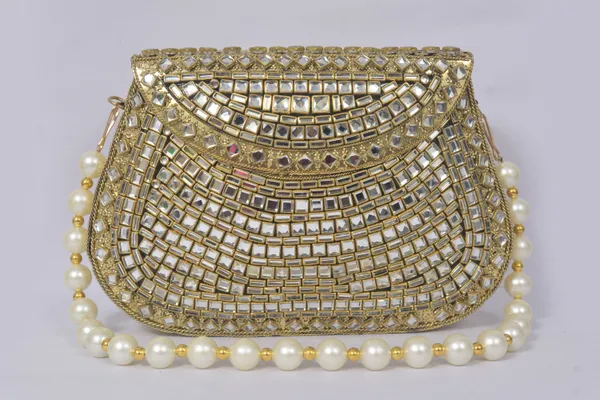 Golden_Elzara_Kundan_Clutch_With_Mirror_Work,_Emerald_Centerpiece,_And_Pearl_Beads