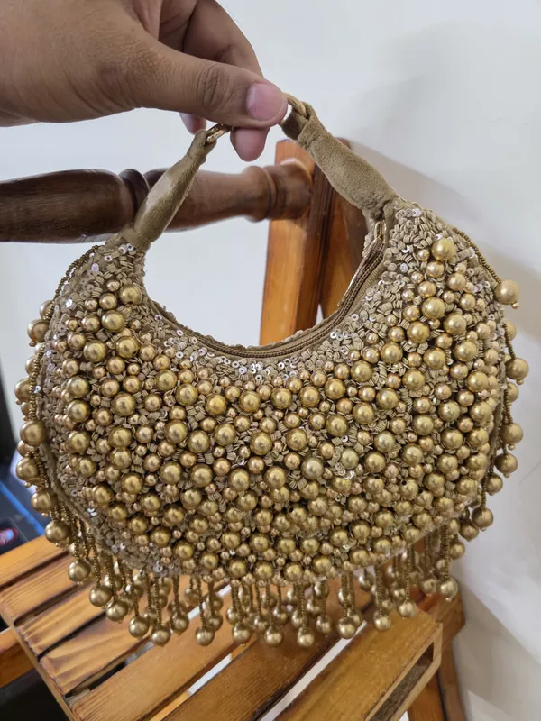 Golden_Dusk_Crescent_Bag_with_Antique_Bead_Embellishments_and_Fringe_Tassels