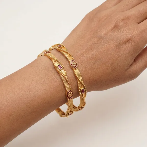 Elegant_2-Piece_Gold_Plated_Bangle_Set_with_Traditional_Ruby-Red_Accents_and_Floral_Textured_Detailing_for_Women