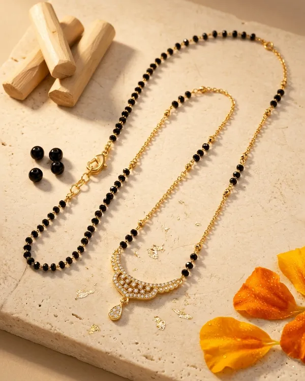 Gold_and_Black_Bead_Mangalsutra_with_Studded_Curve_Pendant