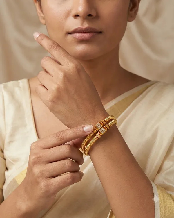 Royal_Twisted_Pattern_Gold-Plated_Brass_Bangles_with_Cubic_Zirconia_&_Ruby_Accents