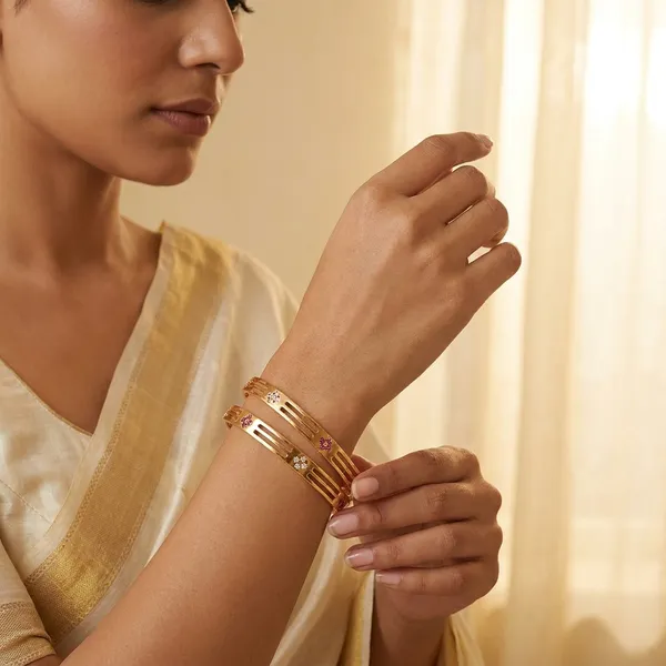 Daily_Wear_Gold-Plated_Brass_Bangles_with_Sleek_Cutouts_and_Stone_Flowers_(Set_of_2)