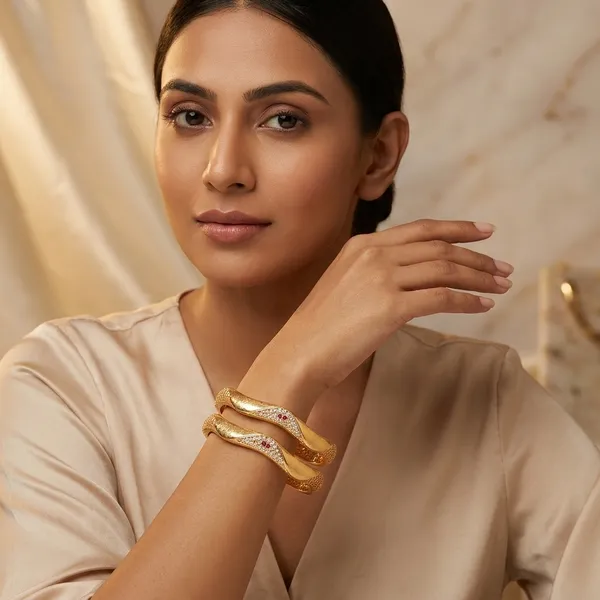 The_Aurelia_Wave_Bangle_Set_(Set_of_2)_�_Gold_Textured_Kada_with_CZ_&_Ruby_Accents