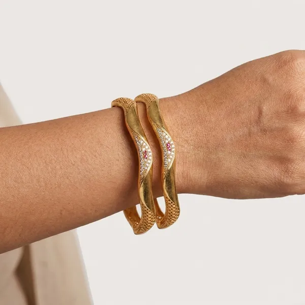 The_Aurelia_Wave_Bangle_Set_(Set_of_2)_�_Gold_Textured_Kada_with_CZ_&_Ruby_Accents