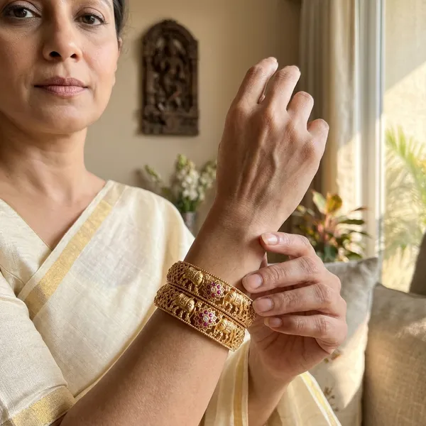 The_Royal_Gajraj_Bangle_Set_�_Set_of_2_Matte_Gold_Temple_Kadas_with_Ruby_Floral_Accents