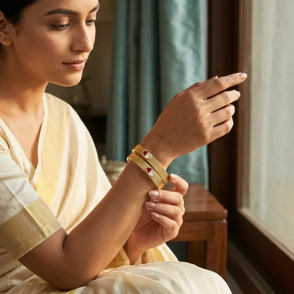 Everyday_Elegance_Brass_Bangles_�_Textured_Gold-Plated_Daily_Wear_Kada_Set_with_Red_&_White_Enamel_Detailing_(Set_of_2)