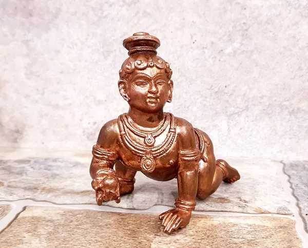 Brownish-Orange_Copper_Idols_Of_God_Bal_Krishna_With_Laddu_By_Searchers_Paradise,_4.1_Inches,_860G,_Patina_Antique_Finish,_Pack_Of_1_Piece