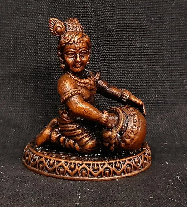 Brownish-Orange_Copper_Idols_India,_1.8_Inches,_Sri_Krishna_Culture_Krishna_Idol_Sitting_And_Stealing_Butter,_85G,_Patina_Antique_Finish,_Pack_Of_1_Piece