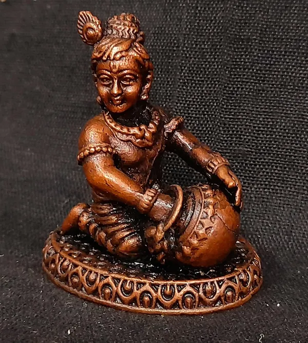 Brownish-Orange_Copper_Idols_India,_1.8_Inches,_Sri_Krishna_Culture_Krishna_Idol_Sitting_And_Stealing_Butter,_85G,_Patina_Antique_Finish,_Pack_Of_1_Piece