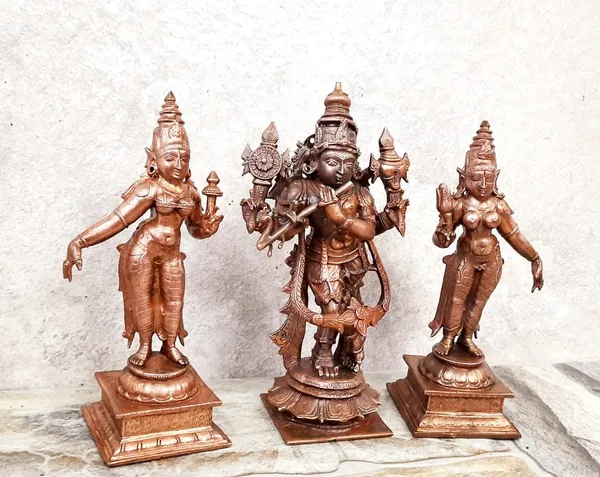 Brownish-Orange_Copper_Idols_Of_God_Venugopala_Swamy_With_Sridevi_And_Bhudevi,_5.7_Inches,_1.5_Kg,_Patina_Antique_Finish,_Pack_Of_3_Piece