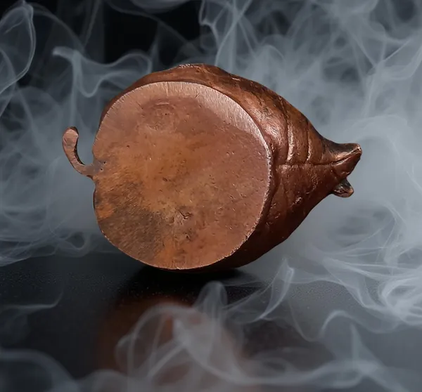 Brownish-Orange_Copper_Idols,_6_Cm,_Handmade_Bal_Krishna_Lying_In_Banyan_Leaf_82_Gram,_Patina_Antique_Finish,_Pack_Of_1_Piece
