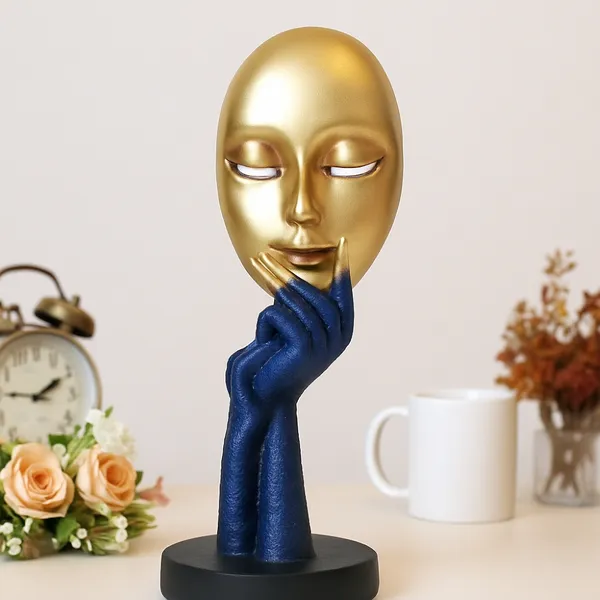Modern_Art_Golden_Face_Sculpture_with_Blue_Hands_â€“_Abstract_Decor_Piece