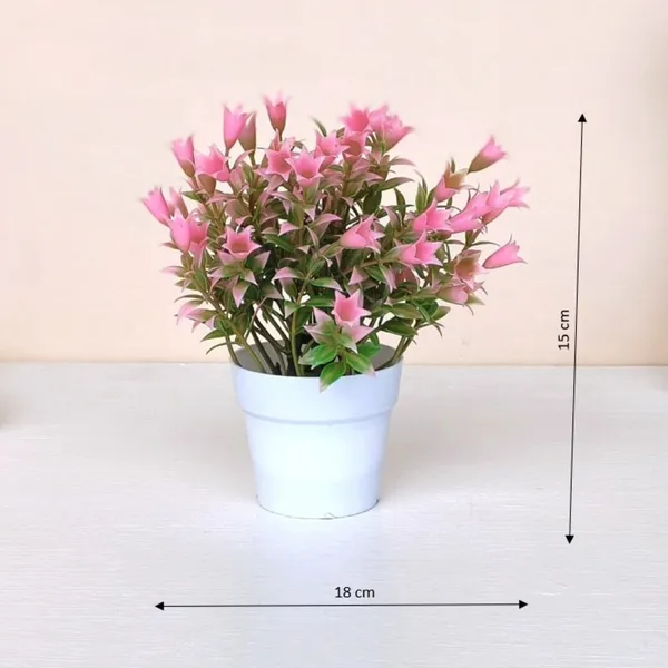 Beautiful_Pink_Floral_Display_with_Green_Leaves_in_a_White_Pot