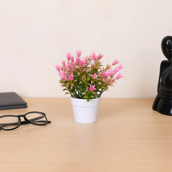 Beautiful_Pink_Floral_Display_with_Green_Leaves_in_a_White_Pot