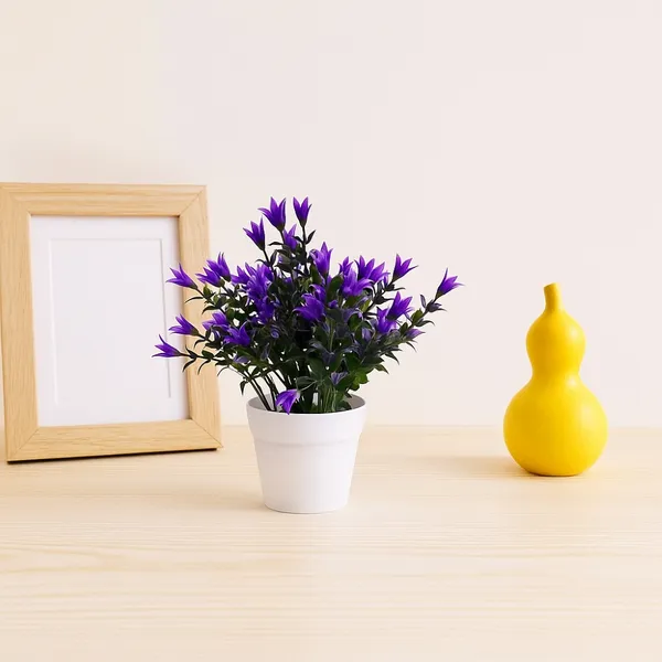 Beautiful_Blue_Floral_Display_with_Green_Leaves_in_a_White_Pot