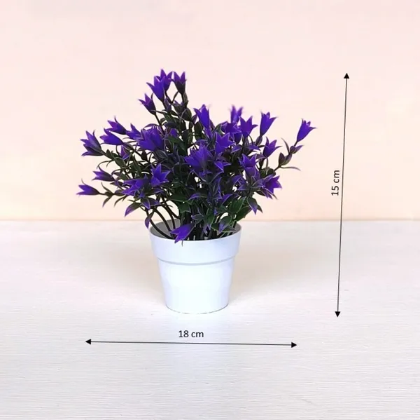 Beautiful_Blue_Floral_Display_with_Green_Leaves_in_a_White_Pot