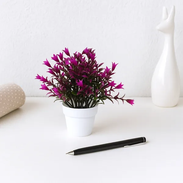 Beautiful_Purple_Floral_Display_with_Green_Leaves_in_a_White_Pot