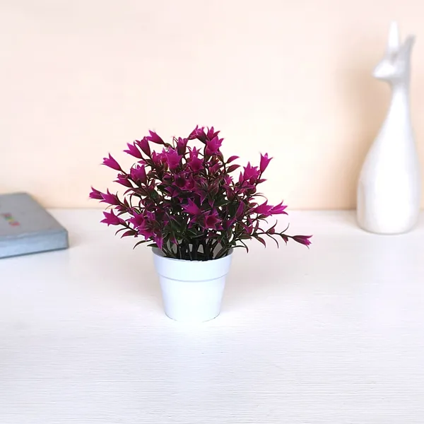 Beautiful_Purple_Floral_Display_with_Green_Leaves_in_a_White_Pot