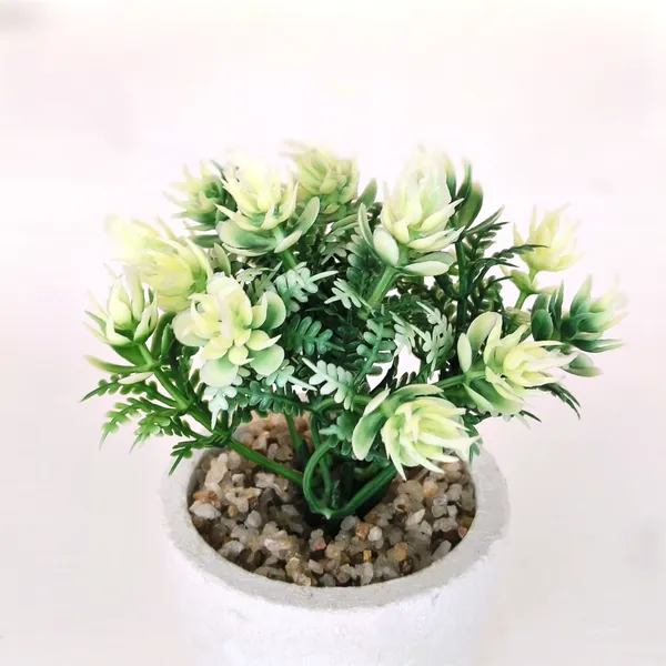 Elegant_Artificial_Green_Plant_Arrangement_in_a_White_Finish_Pot_with_Decorative_Pebbles